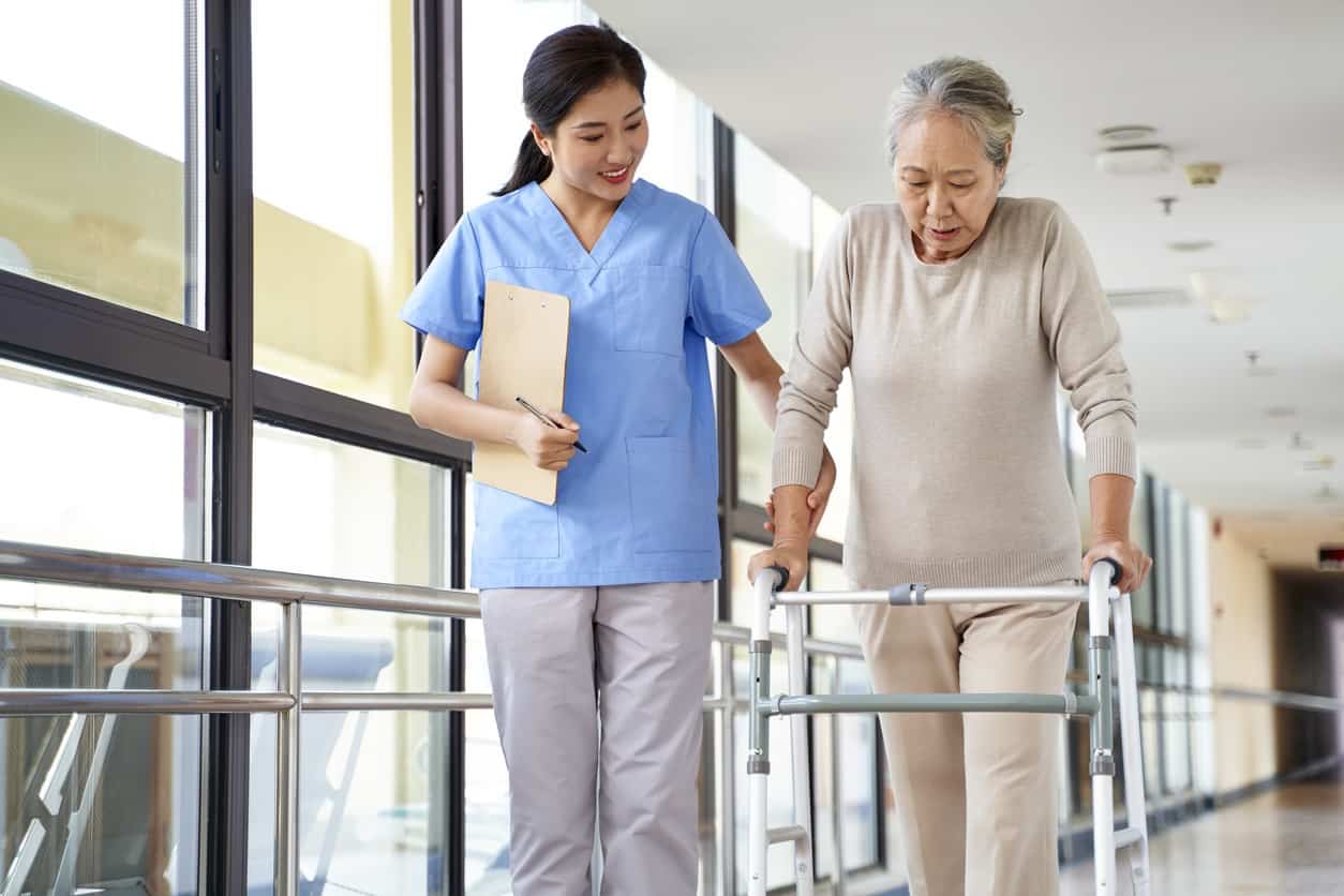 Physical therapist helping patient with rehabilitation